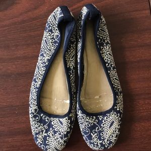 Embroidered navy with gold flats